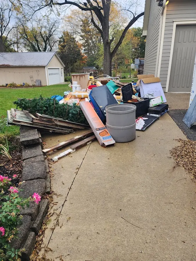 Dumpster being loaded with debris for 3 Yard Dumpster Rental in Wauconda